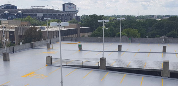 The top level of a parking garage with a coating.