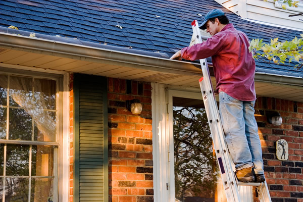 Homeowner checking the gutters