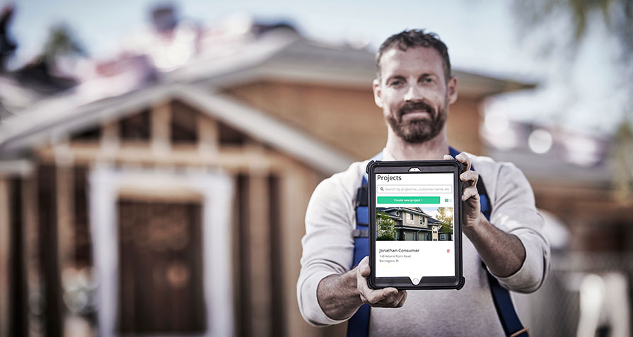 contractor holding tablet with sumoquote project