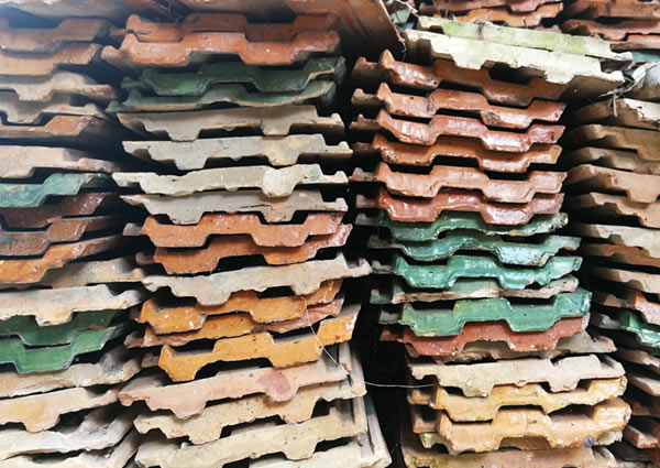 Stacks of terra cotta roof tiles—eco-friendly roofing