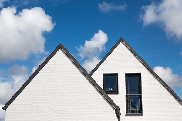 A home with white siding and a double-gable roof.