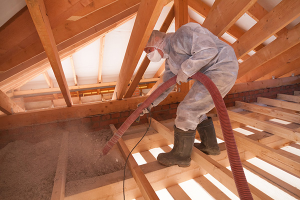 Worker insulating roof.